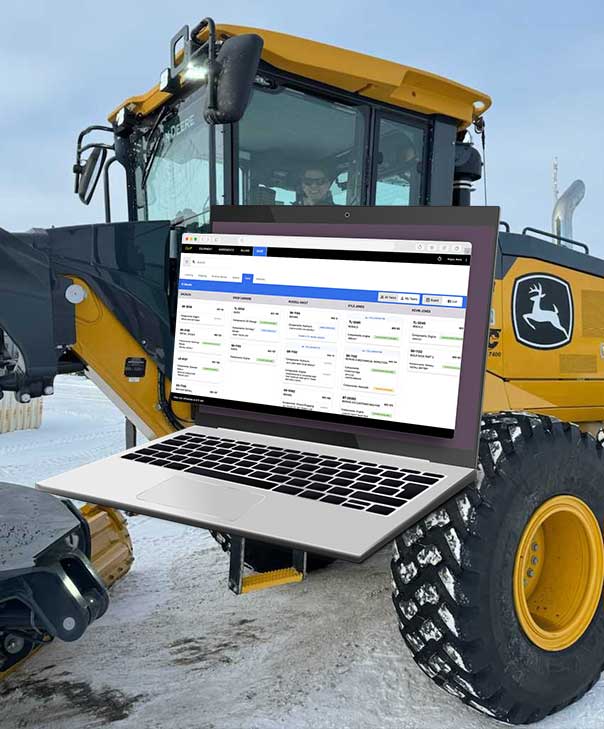 A laptop floats over a tractor.