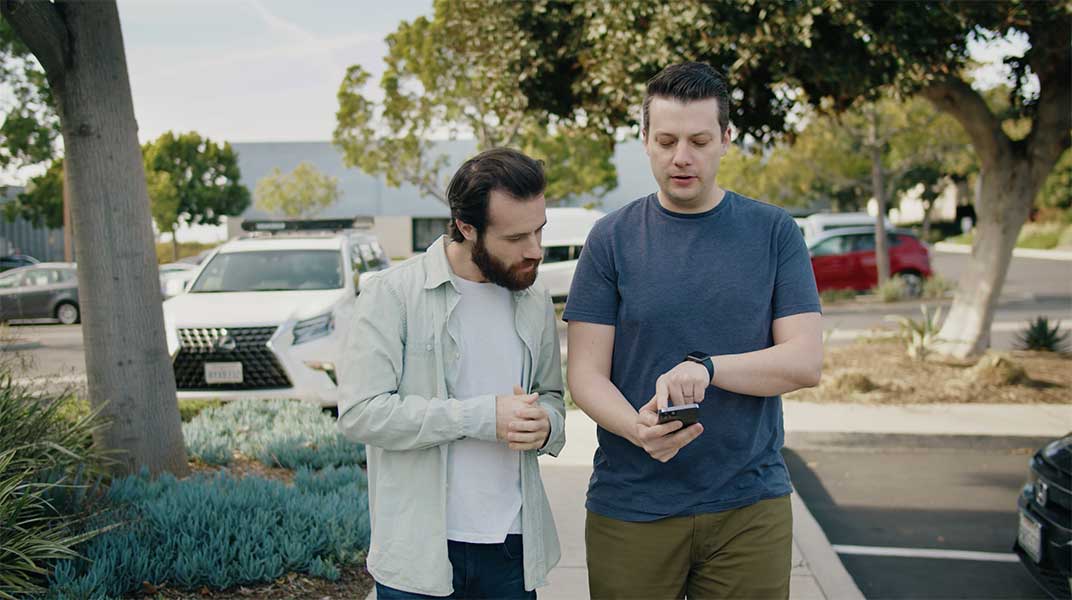 Our Development Coordinator Paul shows a client how to access his app.