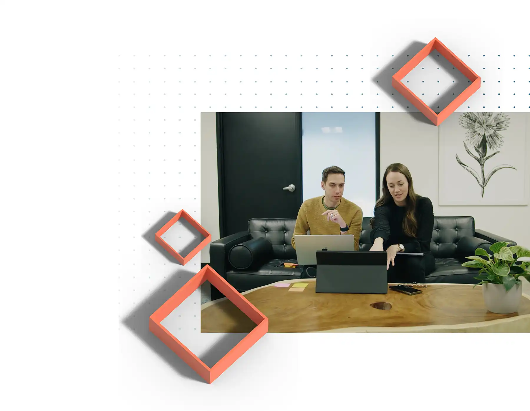 Two TSG designers review a UX design prototype